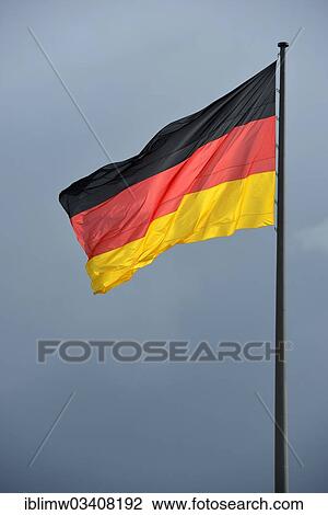 "German flag against a dark sky, stormy atmosphere, Berlin, Berlin, Germany, Europe" View Large Photo Image Stock Image - "German flag against a dark sky, stormy atmosphere, Berlin, Berlin, Germany, Europe". Fotosearch