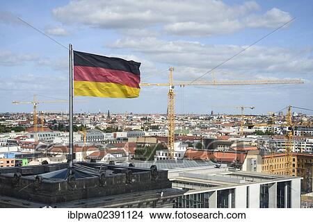 Picture - "German flag with a view over Berlin from the roof terrace of the Reichstag Building, Berlin, Germany, Europe". Fotosearch