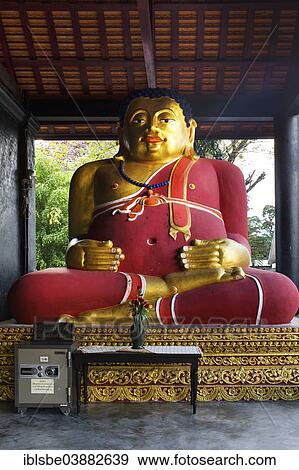 Stock Photo - "Gilded Buddha beside a safe in the courtyard of Wat Chedi Luang Temple, Chiang Mai, Northern Thailand, Thailand, Asia". Fotosearch