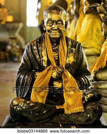 "Gilded monk statue in the mountain temple of Wat Phra That Doi Tung, Chiang Rai, Chiang Rai Province, Northern Thailand, Thailand, Asia" View Large Photo Image Stock Photo - "Gilded monk statue in the mountain temple of Wat Phra That Doi Tung, Chiang Rai, Chiang Rai Province, Northern Thailand, Thailand, Asia". Fotosearch