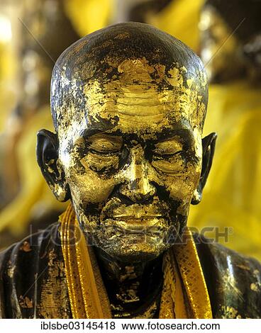 Stock Photo - "Gilded monk statue in the mountain temple of Wat Phra That Doi Tung, Chiang Rai, Chiang Rai Province, Northern Thailand, Thailand, Asia". Fotosearch