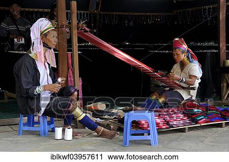 "Giraffe Women, Padaung, women with heavy brass coils as necklaces and leg jewellery weaving for tourists, ethno tourism, Bagan, Mandalay Region, Myanmar, Asia" View Large Photo Image Stock Image - "Giraffe Women, Padaung, women with heavy brass coils as necklaces and leg jewellery weaving for tourists, ethno tourism, Bagan, Mandalay Region, Myanmar, Asia". Fotosearch