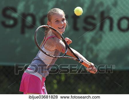 "Girl, 11, playing tennis, hitting a forehand volley, Munich, Upper Bavaria, Bavaria, Germany, Europe" View Large Photo Image Stock Photo - "Girl, 11, playing tennis, hitting a forehand volley, Munich, Upper Bavaria, Bavaria, Germany, Europe". Fotosearch