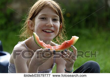 "Girl, 11 years, eating a watermelon" View Large Photo Image Stock Photo - "Girl, 11 years, eating a watermelon". Fotosearch