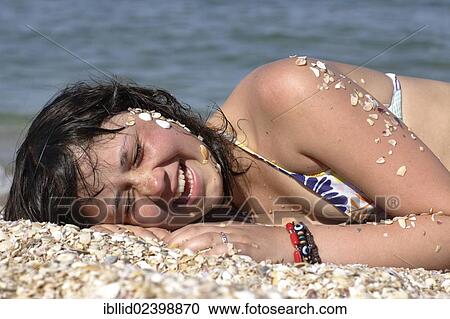 "Girl, 12 years old, lying on the beach" View Large Photo Image Stock Image - "Girl, 12 years old, lying on the beach". Fotosearch