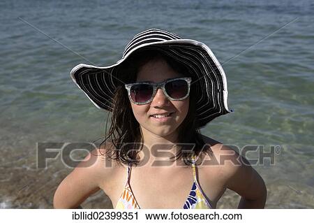 "Girl, 12 years, on a beach, portrait" View Large Photo Image Stock Image - "Girl, 12 years, on a beach, portrait". Fotosearch