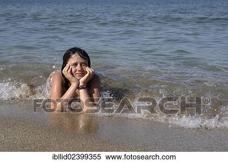 "Girl, 12 years, on a beach" View Large Photo Image Stock Photography - "Girl, 12 years, on a beach". Fotosearch
