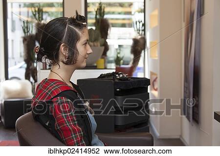 Stock Image - Girl, 14, at the hairdresser. Fotosearch