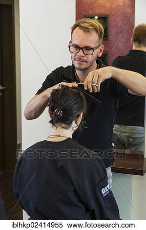 Girl, 14, having her hair cut by a hairdresser View Large Photo Image Stock Photography - Girl, 14, having her hair cut by a hairdresser. Fotosearch