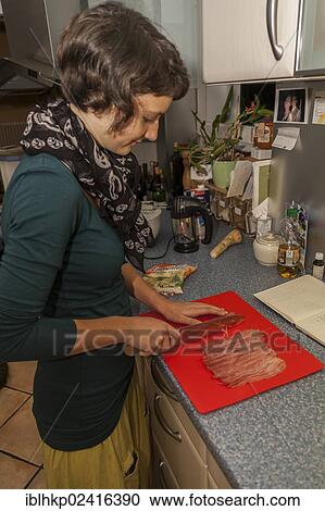 Girl, 14 years old, cutting ham in a kitchen View Large Photo Image Stock Image - Girl, 14 years old, cutting ham in a kitchen. Fotosearch