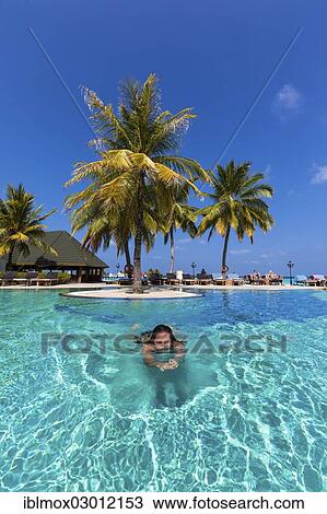 "Girl, 15, swimming in a pool, Paradise Island, Lankanfinolhu, North Male Atoll, Maldives, Asia" View Large Photo Image Stock Image - "Girl, 15, swimming in a pool, Paradise Island, Lankanfinolhu, North Male Atoll, Maldives, Asia". Fotosearch