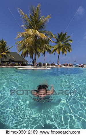 "Girl, 15, swimming in a pool, Paradise Island, Lankanfinolhu, North Male Atoll, Maldives, Asia" View Large Photo Image Stock Photo - "Girl, 15, swimming in a pool, Paradise Island, Lankanfinolhu, North Male Atoll, Maldives, Asia". Fotosearch
