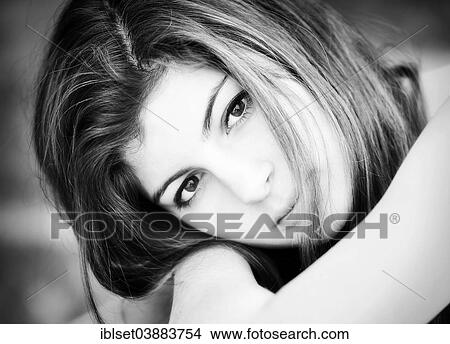 Picture - "Girl, 15 years, resting her head on her arms". Fotosearch