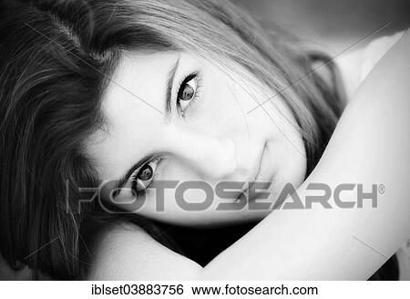 Stock Photograph - "Girl, 15 years, resting her head on her arms". Fotosearch