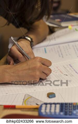 Stock Photograph - "Girl, 16 years, doing math homework, Germany, Europe". Fotosearch