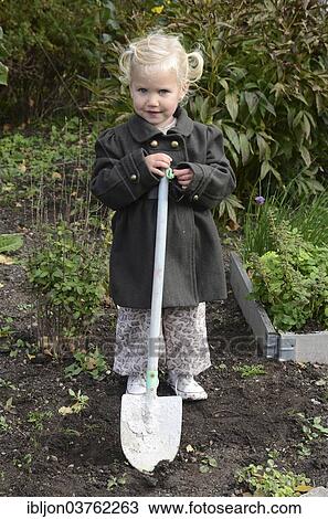 "Girl, 2 years, with a spade in the garden, Ystad, Scania, Sweden, Europe" View Large Photo Image Stock Image - "Girl, 2 years, with a spade in the garden, Ystad, Scania, Sweden, Europe". Fotosearch