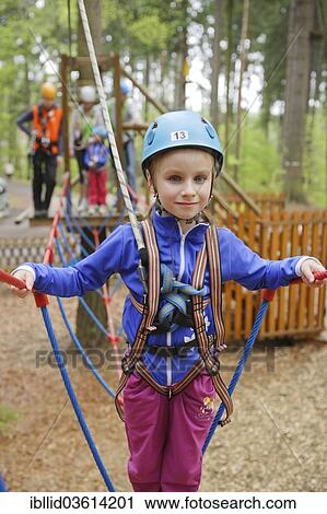 "Girl, 6, climbing in a climbing park, Svaty Linhart, Karlovy Vary, Karlovy Vary Region, Bohemia, Czech Republic, Europe" View Large Photo Image Stock Image - "Girl, 6, climbing in a climbing park, Svaty Linhart, Karlovy Vary, Karlovy Vary Region, Bohemia, Czech Republic, Europe". Fotosearch