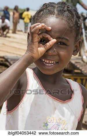 "Girl, 6 years, looking through her fingers, Belo-sur-Tsirihibina, Madagascar, Africa" View Large Photo Image Stock Image - "Girl, 6 years, looking through her fingers, Belo-sur-Tsirihibina, Madagascar, Africa". Fotosearch