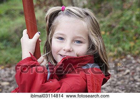 Picture - "Girl, 6 years, on a swing, portrait, Esslingen, Baden-Wurttemberg, Germany, Europe". Fotosearch