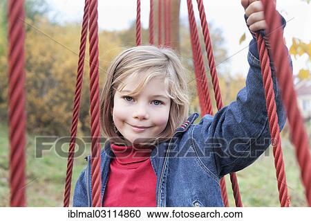 Stock Image - "Girl, 7 years, portrait, Esslingen, Baden-Wurttemberg, Germany, Europe". Fotosearch