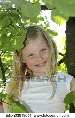 "Girl, 8 years, climbs in a tree, Sweden, Europe" View Large Photo Image Stock Image - "Girl, 8 years, climbs in a tree, Sweden, Europe". Fotosearch