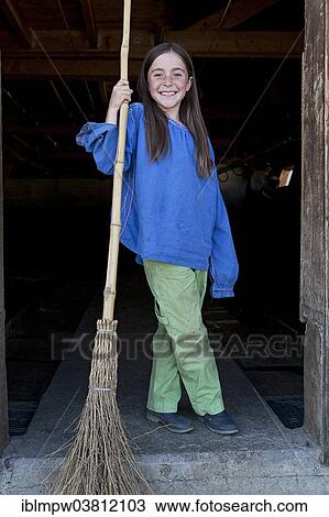 "Girl, 8 years, holding a stable broom, Alp Gun, Graubunden, Switzerland, Europe" View Large Photo Image Stock Image - "Girl, 8 years, holding a stable broom, Alp Gun, Graubunden, Switzerland, Europe". Fotosearch