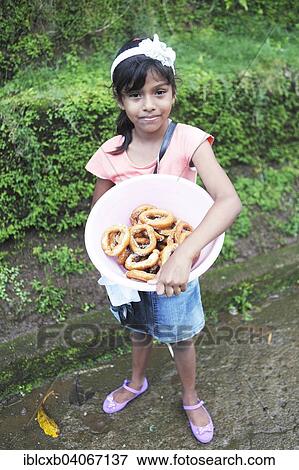 "Girl, 8 years, with homemade donuts, El Castillo, Rio San Juan, Nicaragua, North America" View Large Photo Image Stock Photo - "Girl, 8 years, with homemade donuts, El Castillo, Rio San Juan, Nicaragua, North America". Fotosearch
