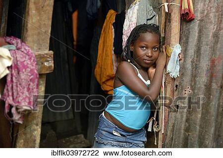 "Girl, 9 years, in the entrance of a shack, Camp Icare for earthquake refugees, Fort National, Port-au-Prince, Haiti, North America" View Large Photo Image Stock Image - "Girl, 9 years, in the entrance of a shack, Camp Icare for earthquake refugees, Fort National, Port-au-Prince, Haiti, North America". Fotosearch