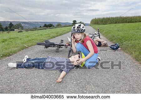 "Girl, 9 years, phoning for help after a bicycle accident" View Large Photo Image Stock Photography - "Girl, 9 years, phoning for help after a bicycle accident". Fotosearch
