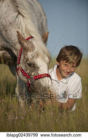 Girl and a pony on a meadow View Large Photo Image Stock Photo - Girl and a pony on a meadow. Fotosearch