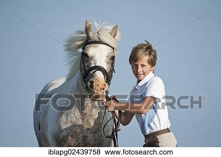 Girl and a pony View Large Photo Image Stock Photo - Girl and a pony. Fotosearch