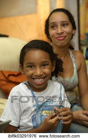 "Girl and mother in a slum or favela, Jacarezinho favela, Rio de Janeiro, Rio de Janeiro State, Brazil, South America" View Large Photo Image Stock Photograph - "Girl and mother in a slum or favela, Jacarezinho favela, Rio de Janeiro, Rio de Janeiro State, Brazil, South America". Fotosearch