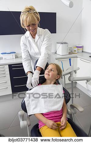 Stock Photo - "Girl at the dentist, dental assistant preparing the patient, Germany, Europe". Fotosearch
