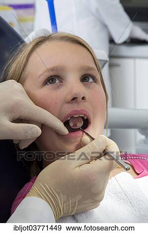 "Girl at the dentist, Germany, Europe" View Large Photo Image Stock Photo - "Girl at the dentist, Germany, Europe". Fotosearch