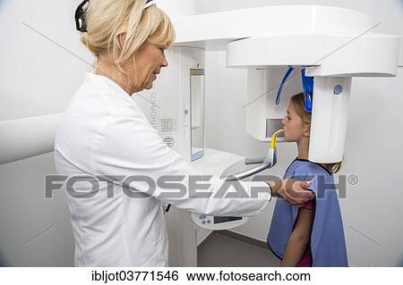 "Girl being prepared for an x-ray of her teeth, wearing a lead vest as radiation protection, Germany, Europe" View Large Photo Image Stock Photograph - "Girl being prepared for an x-ray of her teeth, wearing a lead vest as radiation protection, Germany, Europe". Fotosearch