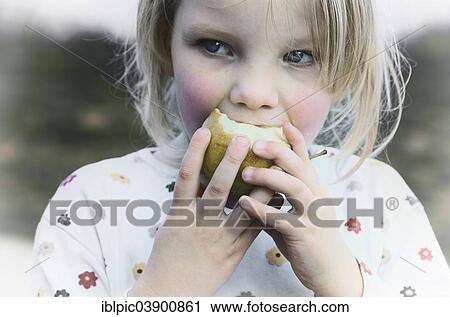 Girl eating an apple View Large Photo Image Stock Image - Girl eating an apple. Fotosearch