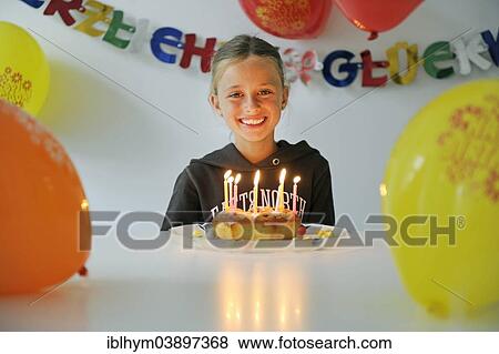 "Girl, eight years, celebrating her birthday" View Large Photo Image Stock Photo - "Girl, eight years, celebrating her birthday". Fotosearch