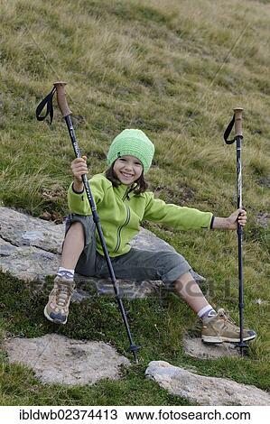 Stock Image - "Girl hiking, Raschoetz near St. Ulrich or Ortisei, Val Gardena valley or Groednertal valley, province of Bolzano-Bozen, Alto Adige, Italy, Europe". Fotosearch