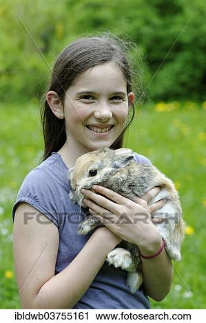 "Girl holding a dwarf rabbit, Upper Bavaria, Bavaria, Germany, Europe" View Large Photo Image Stock Image - "Girl holding a dwarf rabbit, Upper Bavaria, Bavaria, Germany, Europe". Fotosearch