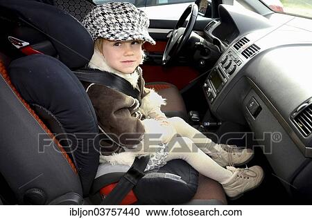 "Girl in a car safety seat in a car, Scania, Sweden, Europe" View Large Photo Image Stock Image - "Girl in a car safety seat in a car, Scania, Sweden, Europe". Fotosearch