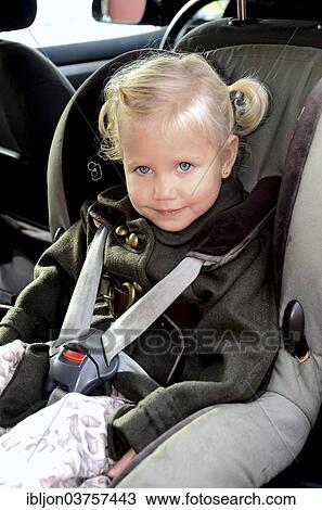 "Girl in a car safety seat in a car, Scania, Sweden, Europe" View Large Photo Image Stock Image - "Girl in a car safety seat in a car, Scania, Sweden, Europe". Fotosearch