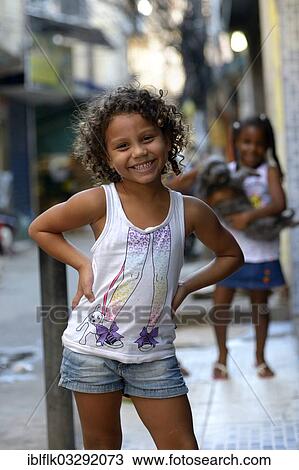 "Girl in a slum or favela, Jacarezinho favela, Rio de Janeiro, Rio de Janeiro State, Brazil, South America" View Large Photo Image Stock Image - "Girl in a slum or favela, Jacarezinho favela, Rio de Janeiro, Rio de Janeiro State, Brazil, South America". Fotosearch