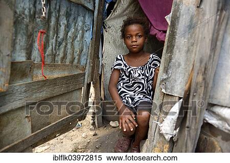 "Girl in the entrance of a shack, Camp Icare for earthquake refugees, Fort National, Port-au-Prince, Haiti, North America" View Large Photo Image Stock Photography - "Girl in the entrance of a shack, Camp Icare for earthquake refugees, Fort National, Port-au-Prince, Haiti, North America". Fotosearch