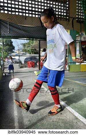 "Girl juggling a football, soccer tournament with children on the sports ground of a slum, Morro dos Prazeres favela, Rio de Janeiro, Brazil, South America" View Large Photo Image Stock Photography - "Girl juggling a football, soccer tournament with children on the sports ground of a slum, Morro dos Prazeres favela, Rio de Janeiro, Brazil, South America". Fotosearch