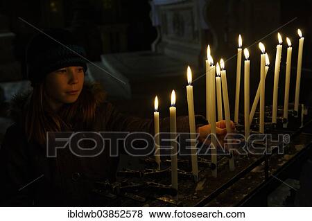 "Girl lighting a votive candle, San Zaccaria Church, San Marco district, Venice, Veneto, Italy, Europe" View Large Photo Image Stock Photo - "Girl lighting a votive candle, San Zaccaria Church, San Marco district, Venice, Veneto, Italy, Europe". Fotosearch