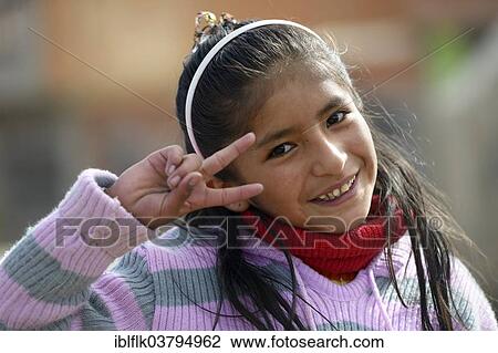 "Girl making the victory sign, El Alto, Department of La Paz, Bolivia, South America" View Large Photo Image Stock Image - "Girl making the victory sign, El Alto, Department of La Paz, Bolivia, South America". Fotosearch