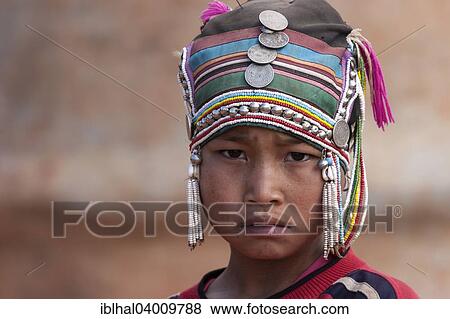 "Girl of the Akha ethnic group with traditional headdress, portrait, near Kyaing Tong, Myanmar, Asia" View Large Photo Image Stock Photo - "Girl of the Akha ethnic group with traditional headdress, portrait, near Kyaing Tong, Myanmar, Asia". Fotosearch