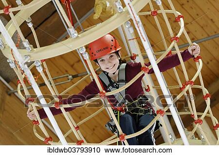 "Girl on an indoor high rope-course in a Salewa Outlet Shop in Fussen, Bavaria, Germany, Europe" View Large Photo Image Stock Image - "Girl on an indoor high rope-course in a Salewa Outlet Shop in Fussen, Bavaria, Germany, Europe". Fotosearch