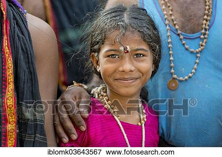 Stock Photo - "Girl, part of a pilgriming Hindu family, portrait, Meenakshi Amman Temple or Sri Meenakshi Sundareswarar Temple, Madurai, Tamil Nadu, India, Asia". Fotosearch