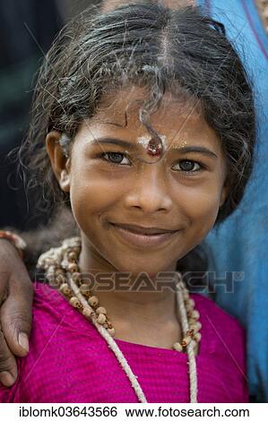 "Girl, part of a pilgriming Hindu family, portrait, Meenakshi Amman Temple or Sri Meenakshi Sundareswarar Temple, Madurai, Tamil Nadu, India, Asia" View Large Photo Image Stock Photograph - "Girl, part of a pilgriming Hindu family, portrait, Meenakshi Amman Temple or Sri Meenakshi Sundareswarar Temple, Madurai, Tamil Nadu, India, Asia". Fotosearch